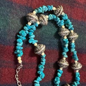 Turquoise Necklace and silver findings. Length 20-25”. Very good condition.